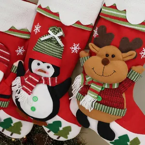 Christmas stocking gift bags with penguin and reindeer embroidery for holiday decor