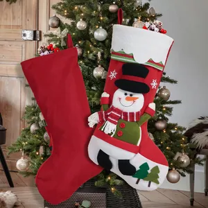 Christmas stocking set with Santa and snowman designs hung on a decorated festive tree