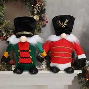 Set of two Christmas nutcracker faceless gnome plush dolls on a festive fireplace mantel