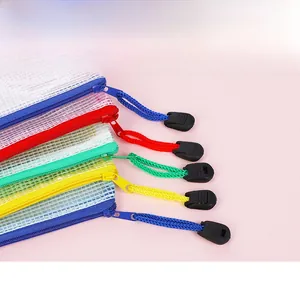 Detail of colorful mesh document bags featuring extended woven zipper pull ropes