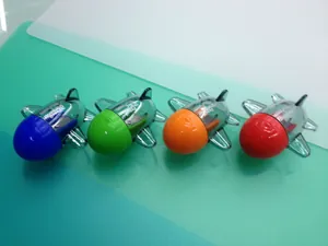Detail showing four colorful airplane pencil sharpeners in blue, green, orange, and red