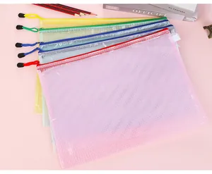 Macro shot of colorful mesh zipper pouches for stationery storage in a fanned stack