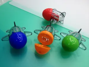 Detailed view of plane-shaped pencil sharpeners with an open orange lid showing the hole