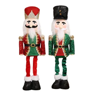Soldati schiaccianoci di Natale in peluche con gambe telescopiche in rosso e verde