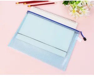 Close-up of a light blue mesh PVC zipper file bag with a notebook inside for office storage