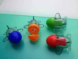 Detail view of colorful cartoon airplane pencil sharpeners with open lid showing blade