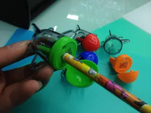Detail of rocket-shaped pencil sharpeners in red, blue, green and orange plastic