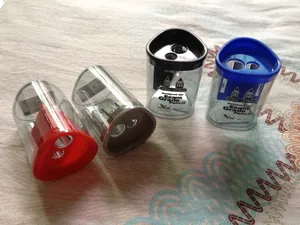 Close-up of dual-hole plastic pencil sharpener with 8mm and 12mm holes in four colors