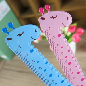 Detailed view of pink and blue 15cm giraffe plastic rulers with wavy edges and scales