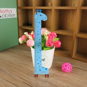 Macro detail of sky blue giraffe ruler showing 15cm scale and wavy edge design