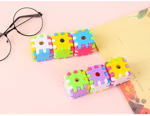 Close-up of colorful cube pencil sharpeners with interlocking plastic brick design
