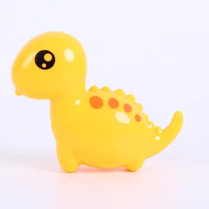 Detail of cute yellow cartoon dinosaur pencil sharpener with smooth plastic finish