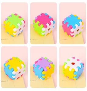 Close-up of colorful interlocking cube pencil sharpener blocks in multiple bright colors