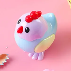 Cute cartoon chick pencil sharpener in pastel colors on a soft pink background