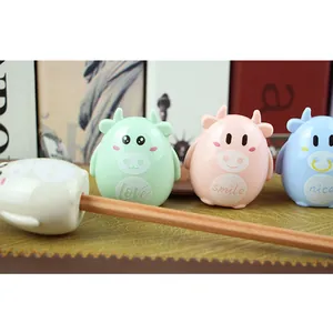 Manual pencil sharpener in cute cartoon cow design with four macaron pastel colors
