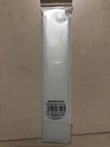Detailed view of folded 30cm plastic ruler in transparent packaging for students