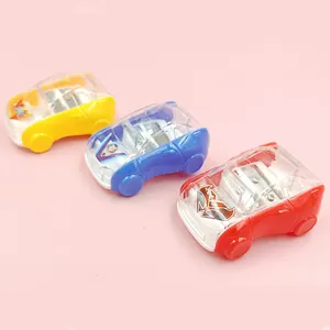 Close-up of cartoon car pencil sharpeners with transparent shells in yellow, blue and red