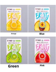 Macro detail of four fruit-themed correction tapes in orange peach kiwi and watermelon styles