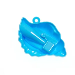 Detail of shell-shaped pencil sharpener in light blue plastic with a hanging hole