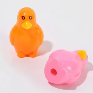 Cute penguin-shaped pencil sharpeners in bright orange and pink for school stationery