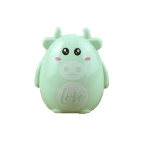Cute green cow shaped manual pencil sharpener with love print on a white background