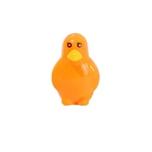 Detail of cute orange penguin-shaped pencil sharpener with a smooth plastic finish