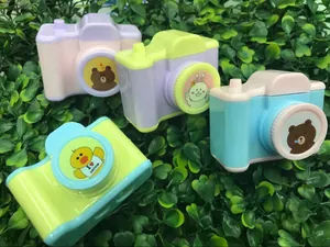 Detailed view of four colorful camera pencil sharpeners with cute cartoon duck and bear designs