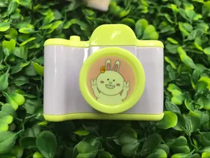Macro detail of camera-shaped pencil sharpener with rabbit print in lavender and green