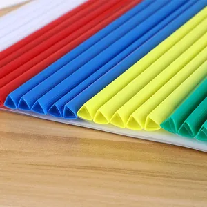 Colorful A4 triangle slide binder bars with transparent folder covers on wooden desk