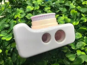 Detail of creative camera-shaped pencil sharpener with dual holes and pastel knobs