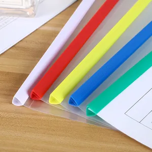A4 clear plastic slide binder folders in five assorted colors on a wooden table