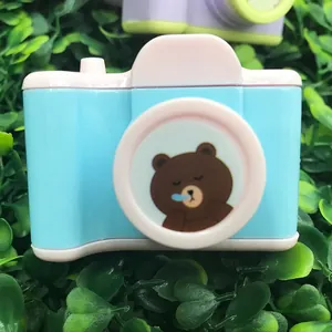 Creative camera-shaped pencil sharpener in blue and pink with cute bear design