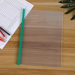 Detail of A4 clear frosted report cover with a vibrant green sliding bar on wood desk