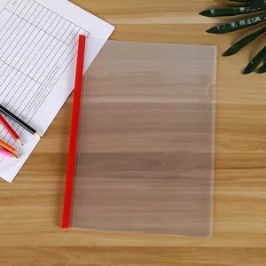 Detail of red sliding bar and clear frosted A4 file folder on a wooden desk