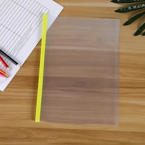 Close-up of A4 transparent report cover with bright green sliding bar on wooden desk