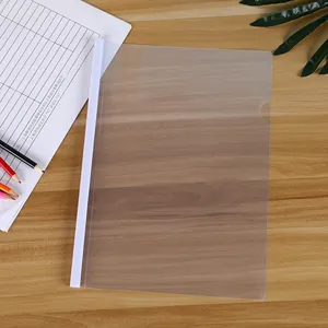 Close-up of A4 clear report cover with white sliding bar on a wooden office desk