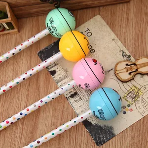 Detailed close-up of lollipop shaped gel pens with colorful polka dot patterns and ball caps