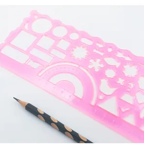 Pink transparent plastic geometric drawing ruler with multi-shape stencils and protractor