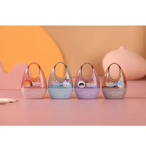 Set of four pastel cartoon pencil sharpeners with round egg shapes and top ring handles