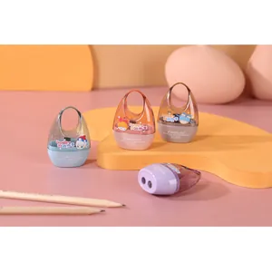 Close-up of dual-hole pencil sharpeners in pastel colors with cute cartoon graphics