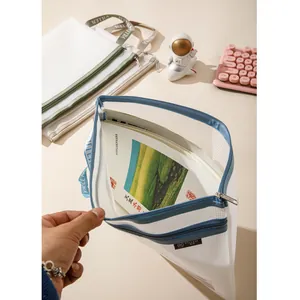 Detail of multi-colored mesh A4 file bags with sturdy handles and smooth zippers
