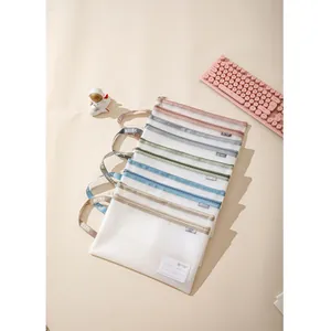 Detailed view of mesh zipper file bags with reinforced handles and ID card slots