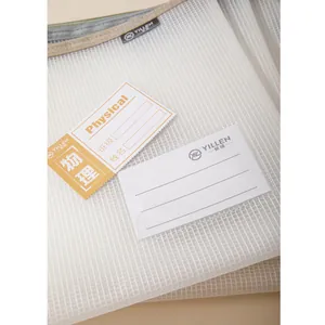 Detail of white mesh file bag with clear index card slot showing physics subject label