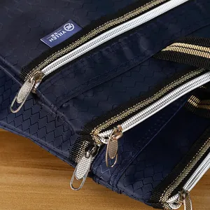 Close-up of waterproof Oxford fabric document bag with multi-layer metal zippers