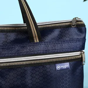 Close-up of diamond lattice texture on navy blue waterproof Oxford cloth briefcase