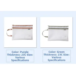 Detail of A4 mesh document bag with double zippers and sturdy side handles for office storage