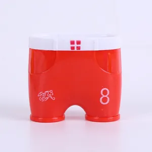 Macro detail of red plastic shorts-shaped dual-hole pencil sharpener with number 8 print