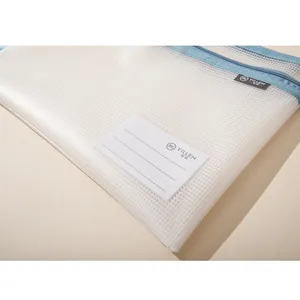 Detail of A4 mesh file bag featuring clear label pocket and blue zipper closure