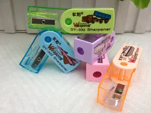 Detail of colorful plastic pencil sharpeners featuring military vehicle illustrations