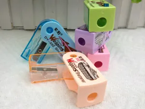 Detail of colorful plastic pencil sharpeners featuring military tank and aircraft prints